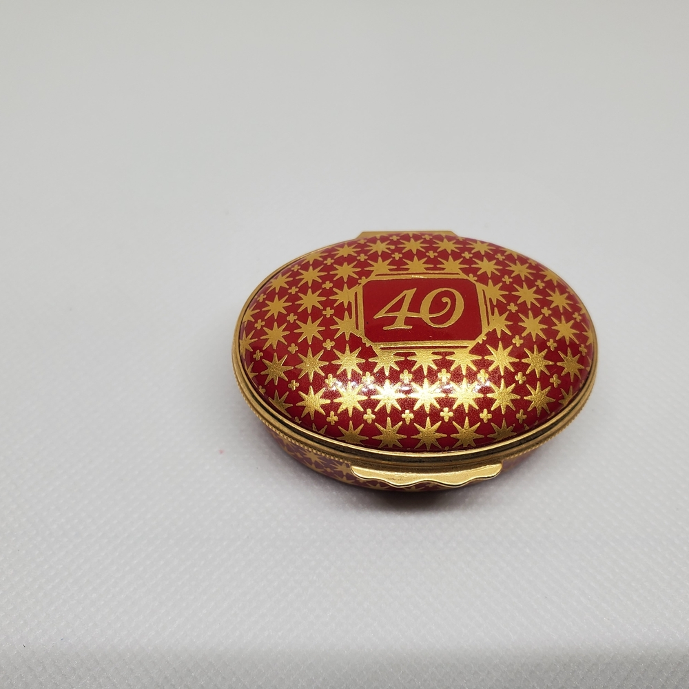 This Halcyon Days Enamels Red and Gold Decorative Trinket Box